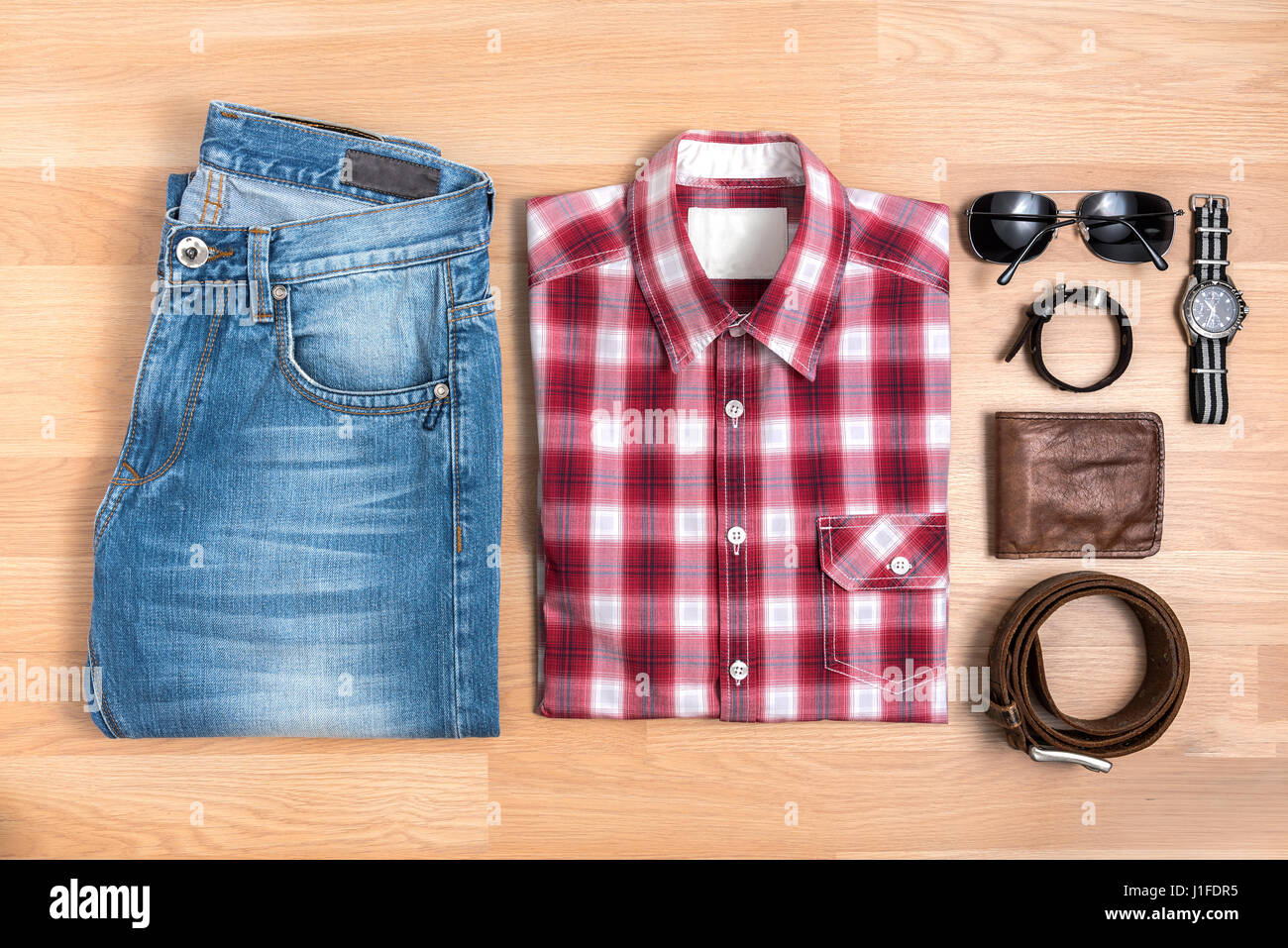 Red plaid shirt and blue jeans 
