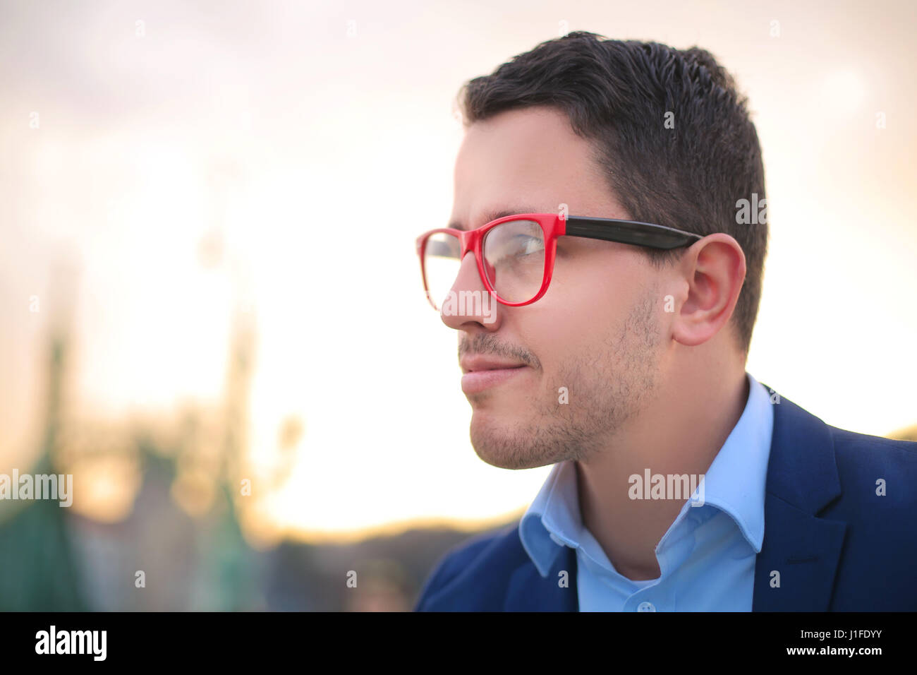 Spectacles Red Man Portrait of a young man with red eyeglasses Stock Photo - Alamy