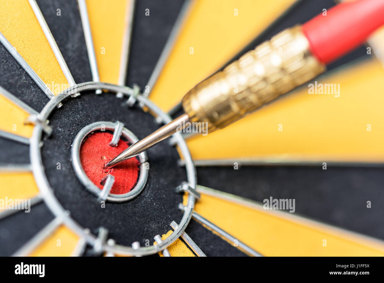 Closeup dart target with arrow on bullseye, Goal target success business investment financial strategy concept, abstract background Stock Photo