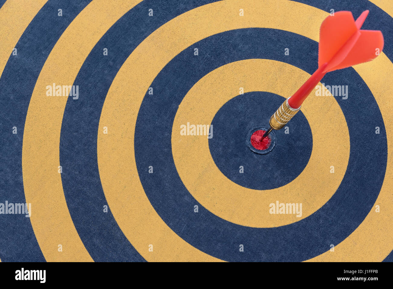 Dart target with arrow on bullseye, Goal target success business investment financial strategy concept, abstract background Stock Photo