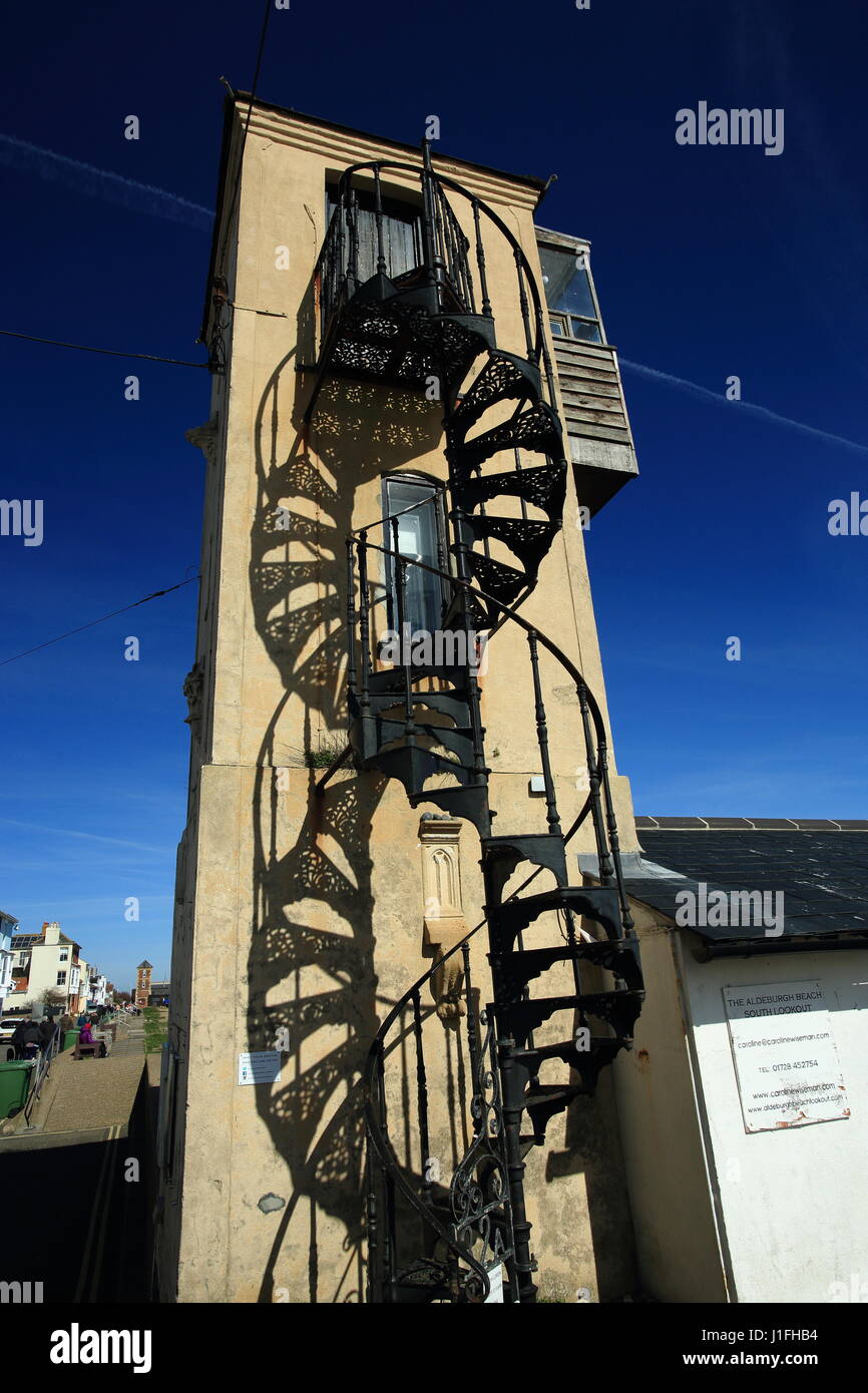 the south lookout on the beach at Aldeburgh suffolk,shadow of a spiral staircase on wall on spring day in sunshine Stock Photo