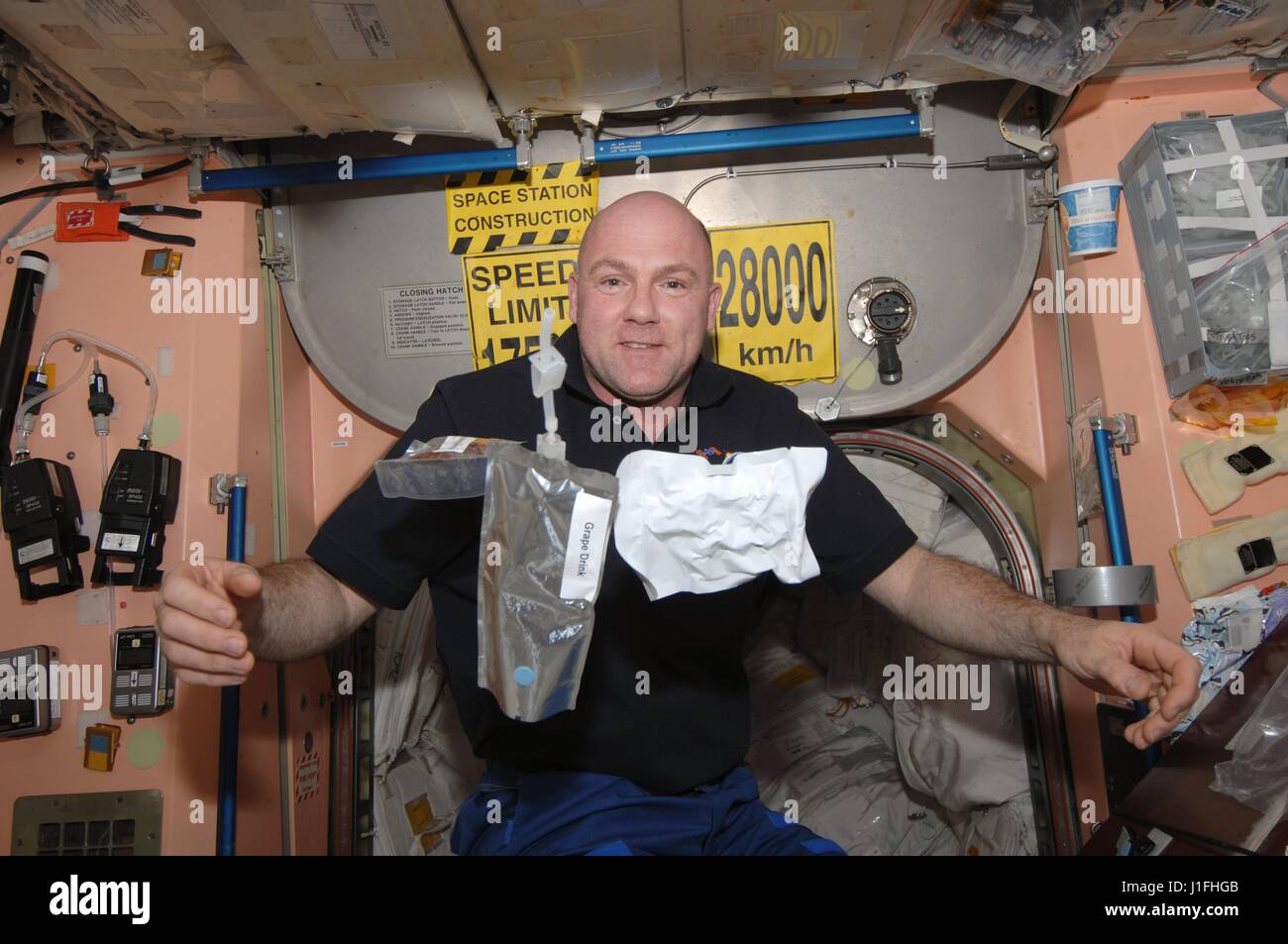 NASA International Space Station Expedition 30 prime crew member Dutch astronaut Andre Kuipers of the European Space Agency floats next to food and drink packets in Node 1 of the ISS January 30, 2012 in Earth orbit.      (photo by NASA Photo /NASA   via Planetpix) Stock Photo