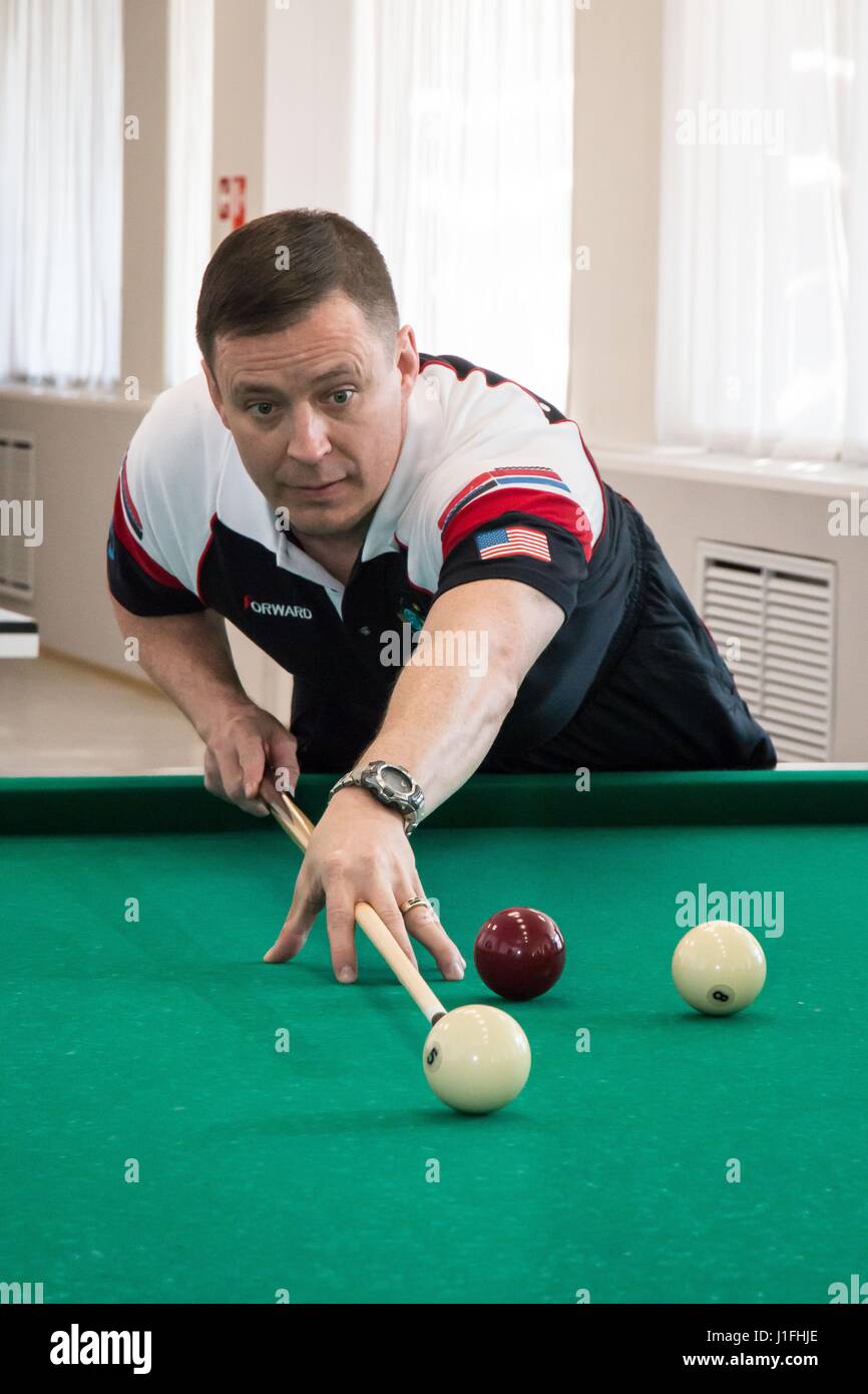 NASA International Space Station Expedition 51 Soyuz MS-04 mission prime crew member American astronaut Jack Fischer plays billiards during pre-launch activities at the Cosmonaut Hotel April 13, 2017 in Baikonur, Kazakhstan.       (photo by Victor Zelentsov /NASA   via Planetpix) Stock Photo