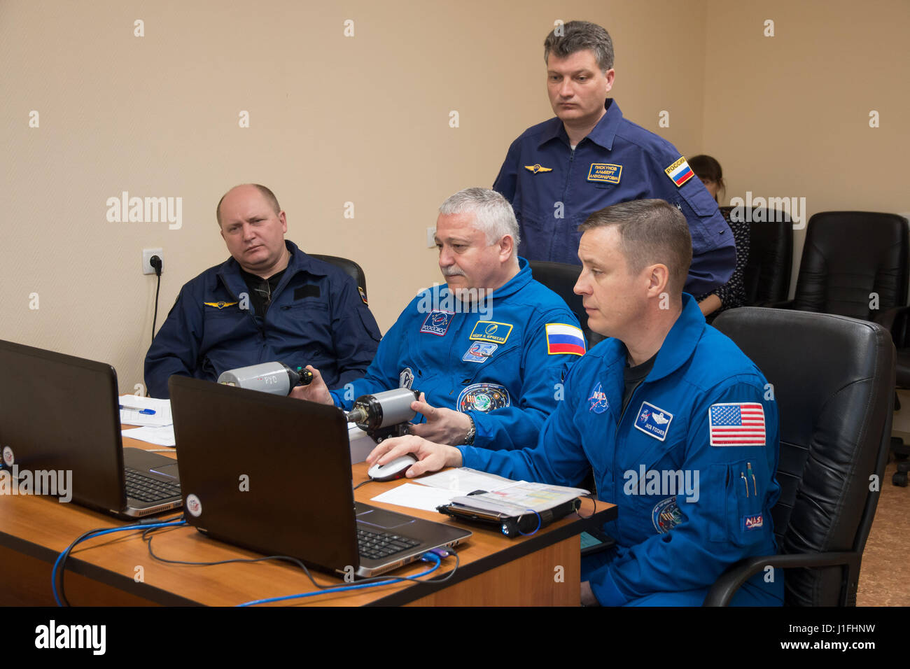 NASA International Space Station Expedition 51 Soyuz MS-04 mission prime crew members Russian cosmonaut Fyodor Yurchikhin of Roscosmos (center) and American astronaut Jack Fischer (right) practice on a laptop simulator during pre-launch training at the Cosmonaut Hotel April 13, 2017 in Baikonur, Kazakhstan.       (photo by Victor Zelentsov /NASA   via Planetpix) Stock Photo