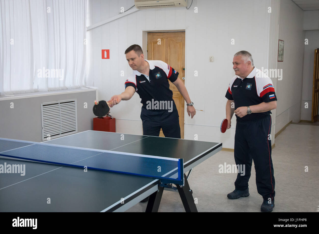 NASA International Space Station Expedition 51 Soyuz MS-04 mission prime crew members American astronaut Jack Fischer (left) and Russian cosmonaut Fyodor Yurchikhin of Roscosmos play a game of ping-pong during pre-launch activities at the Cosmonaut Hotel April 13, 2017 in Baikonur, Kazakhstan.       (photo by Victor Zelentsov /NASA   via Planetpix) Stock Photo