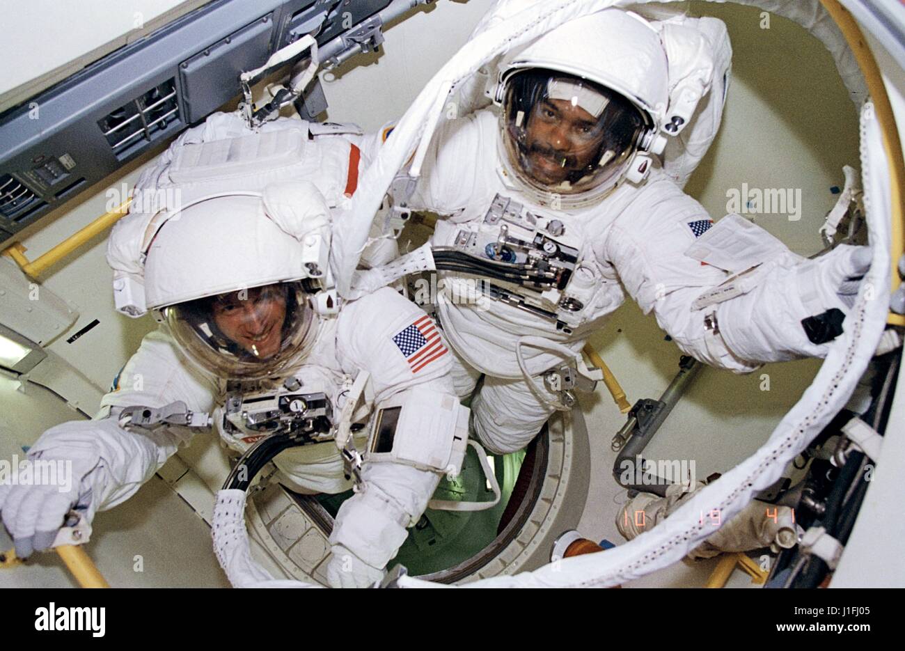 NASA STS-63 SPACEHAB-3 mission prime crew astronauts C. Michael Foale (left) and Bernard Harris, Jr. prepare to leave the space shuttle Discovery airlock for an extravehicular activity spacewalk February 9, 1995 in Earth orbit. During this spacewalk Harris became the first African-American to walk in space and Foale became the first British citizen to walk in space.      (photo by NASA Photo /NASA   via Planetpix) Stock Photo