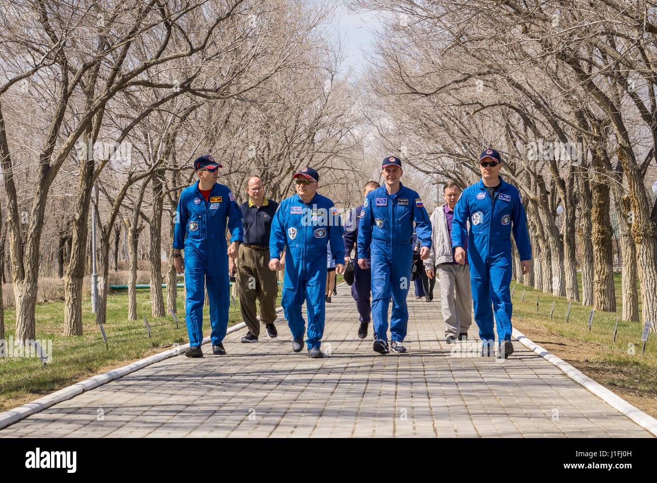 NASA International Space Station Expedition 51 Soyuz MS-04 mission prime and backup crew members (L-R) American astronaut Randy Bresnik, Russian cosmonauts Fyodor Yurchikhin and Sergey Ryazanskiy of Roscosmos, and American astronaut Jack Fischer stroll down the Cosmonaut Hotel Walk of Cosmonauts during pre-launch activities April 13, 2017 in Baikonur, Kazakhstan.      (photo by Victor Zelentsov /NASA   via Planetpix) Stock Photo
