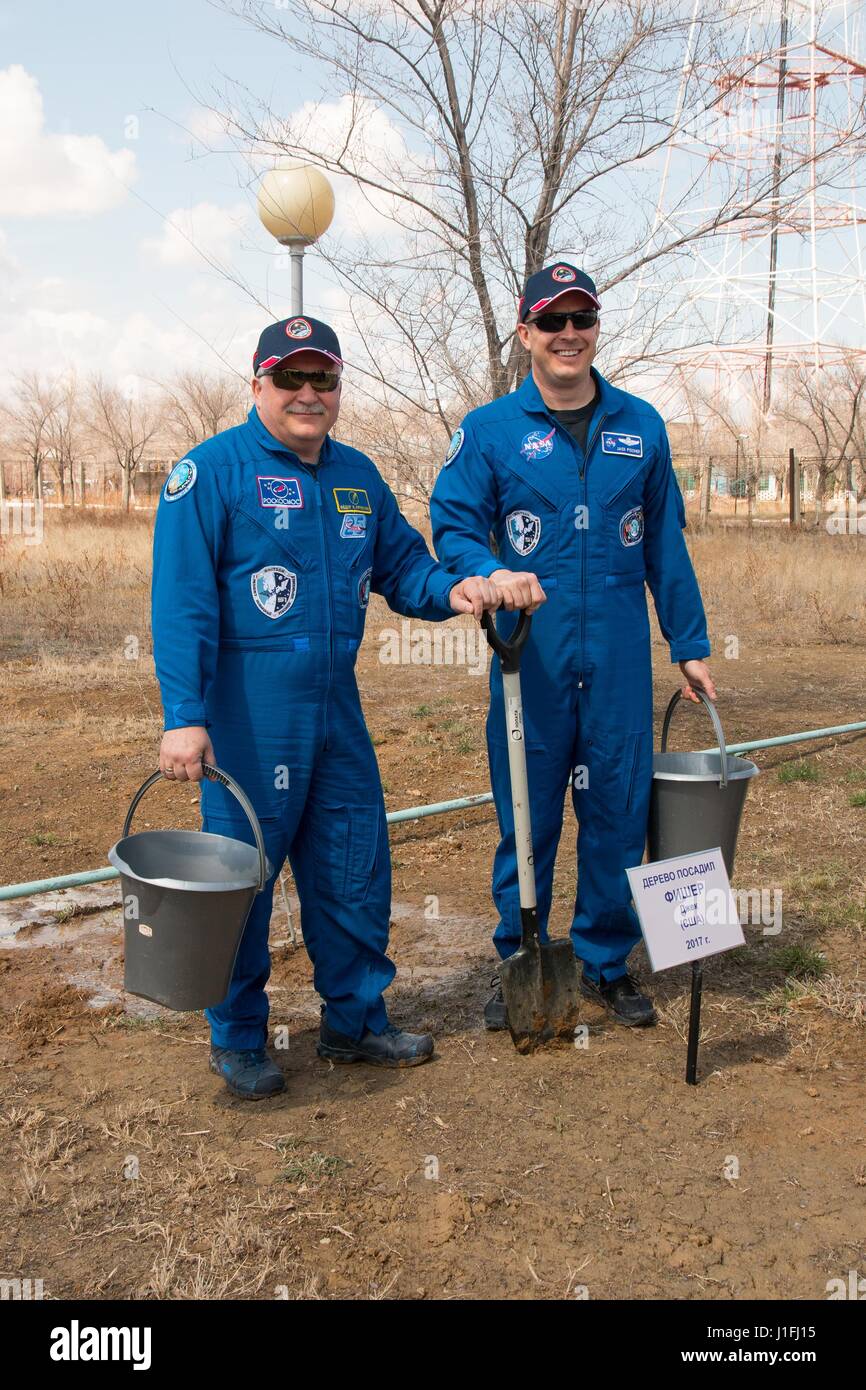 NASA International Space Station Expedition 51 Soyuz MS-04 mission prime crew members Russian cosmonaut Fyodor Yurchikhin of Roscosmos (left) and American astronaut Jack Fischer plant a tree in Fischers name during a traditional pre-launch ceremony at the Cosmonaut Hotel April 13, 2017 in Baikonur, Kazakhstan.       (photo by Victor Zelentsov /NASA   via Planetpix) Stock Photo