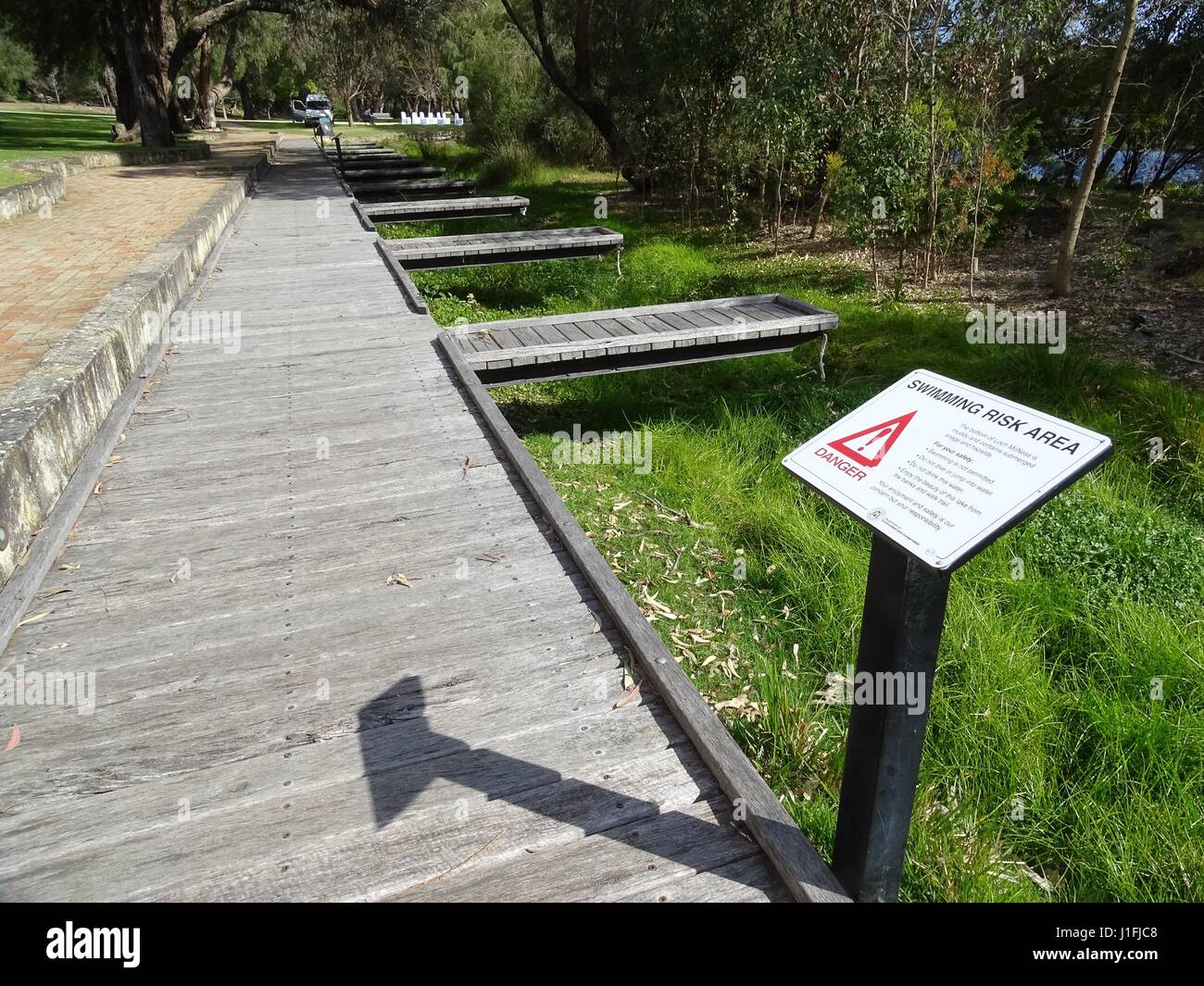 Warning Sign, swim at your own risk Stock Photo Alamy