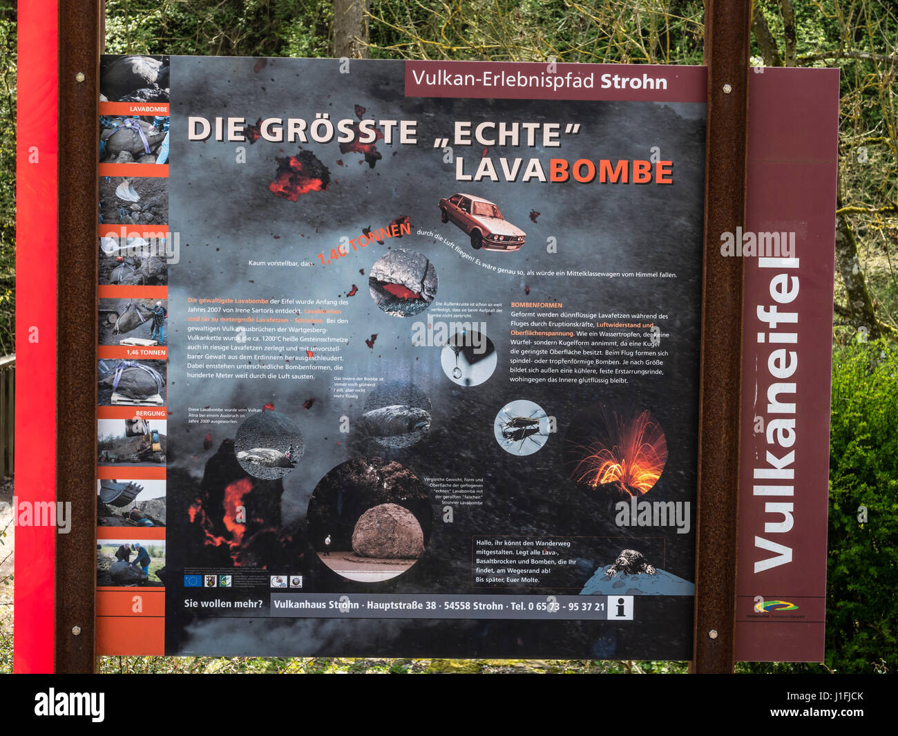 Poster describing volcanic phenomens, largest lava bomb exhibited in village Strohn, near Daun, volcanic region, Eifel, Germany Stock Photo