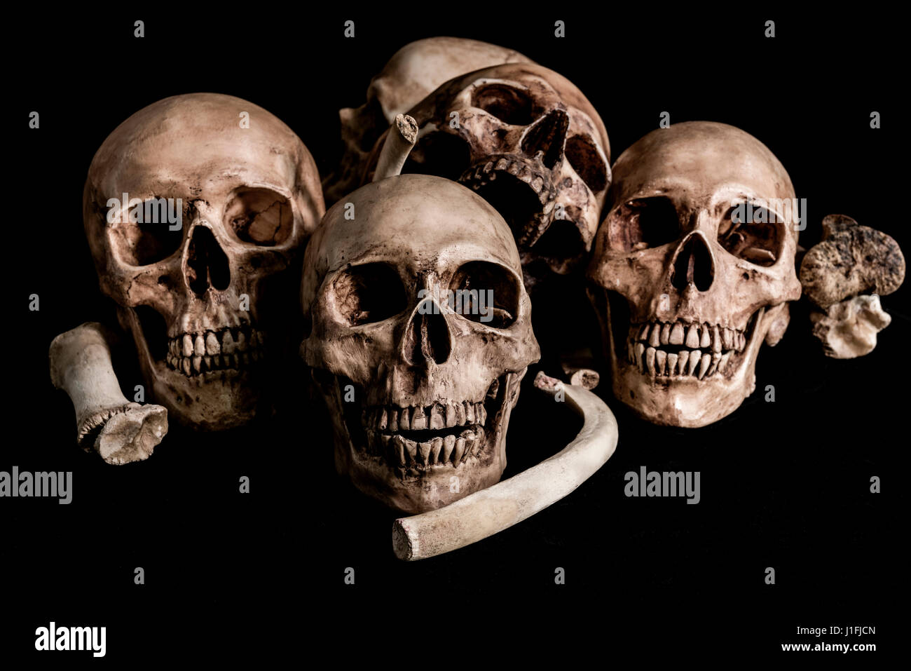 Human skull and bones, genocides concept and horror darkness Stock Photo
