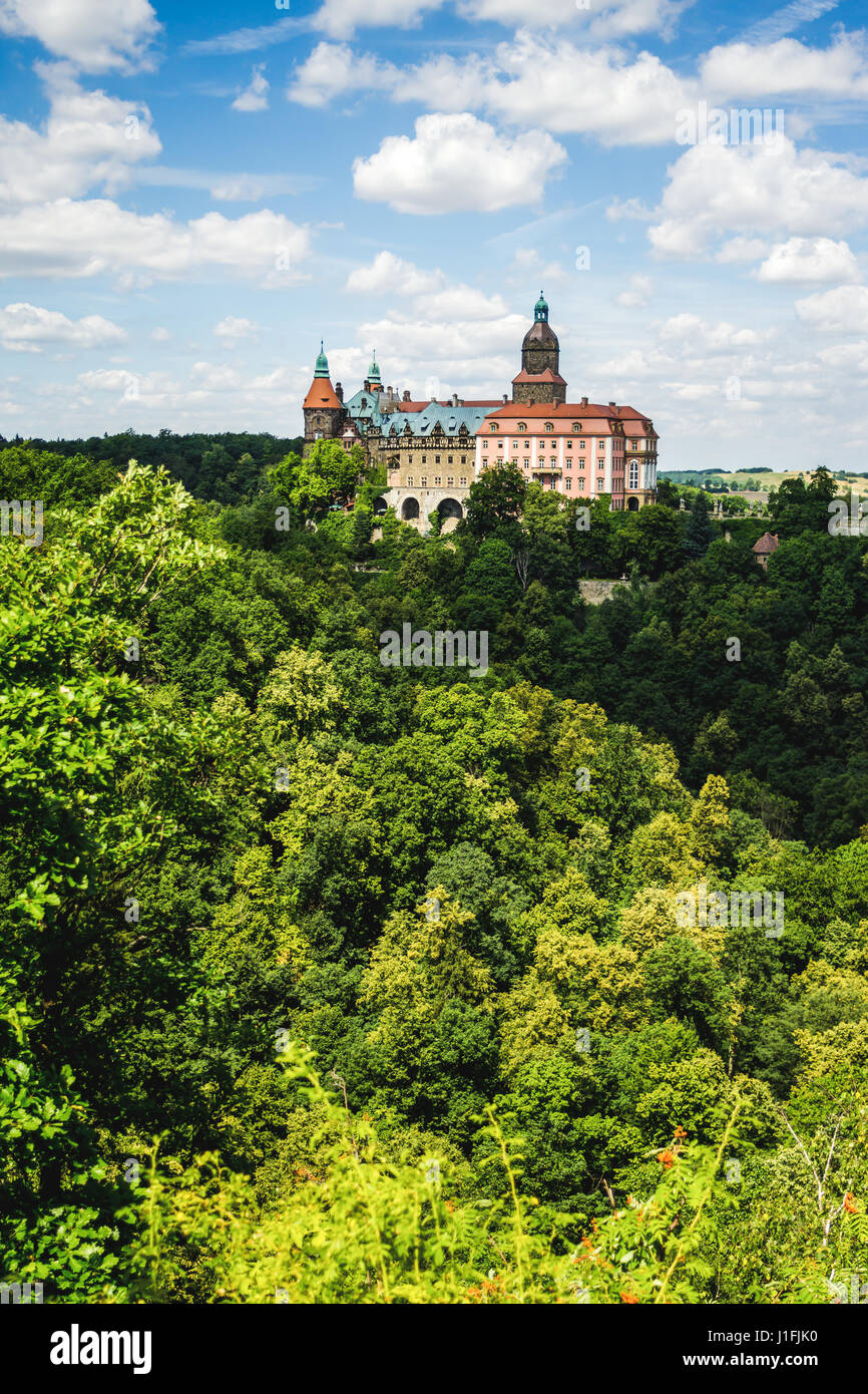 Zamek Ksiaz, a castle in Poland, seen from a lookout point with a forest in the foreground. Stock Photo