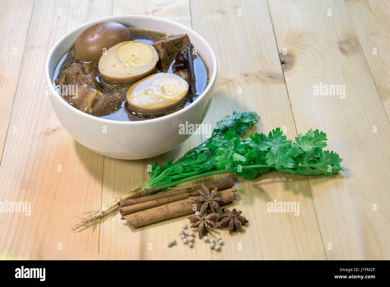 eggs with porks and tofu boiled in the gravy is delicious thaifood Stock Photo