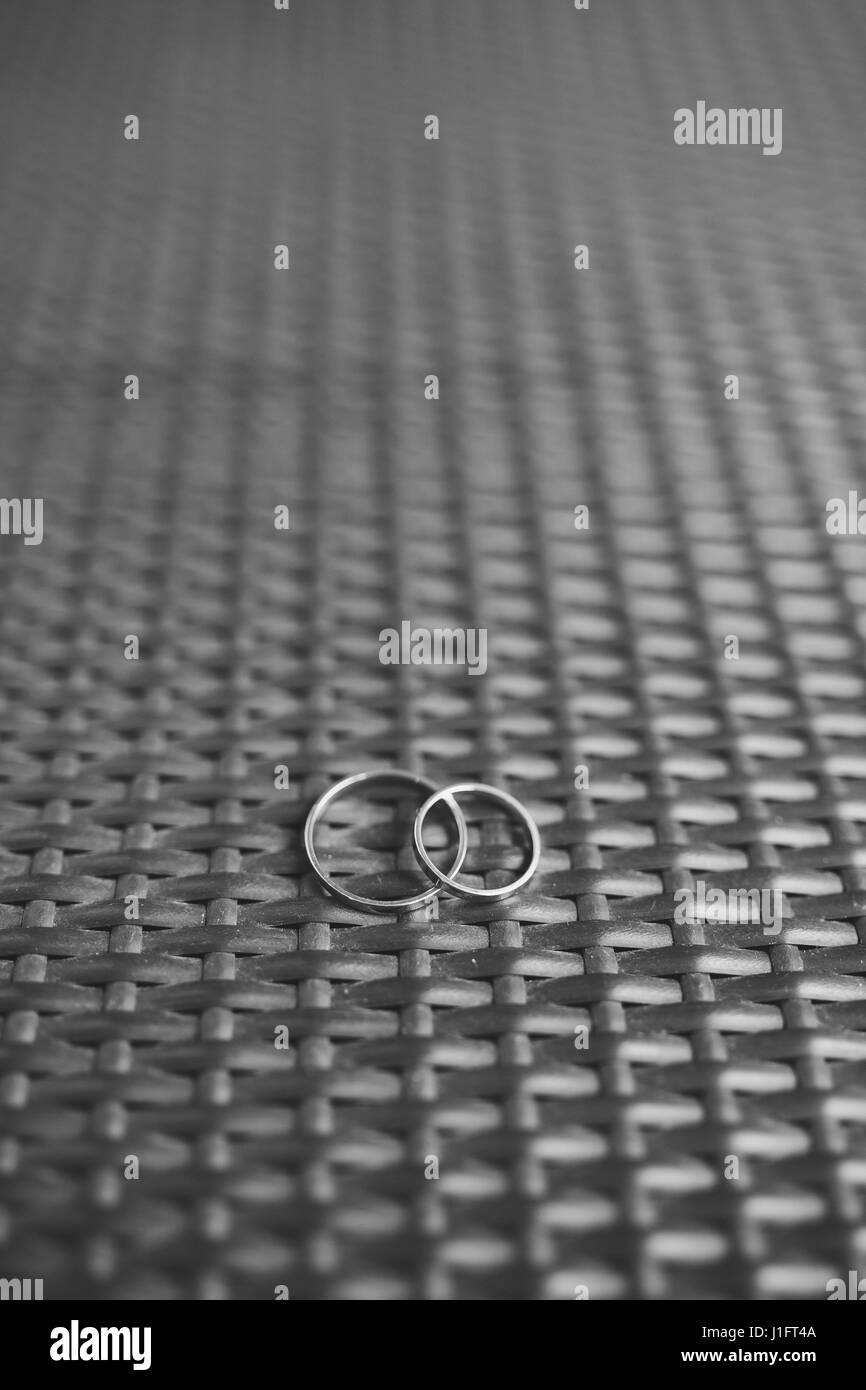 Wedding rings on a textured background Stock Photo