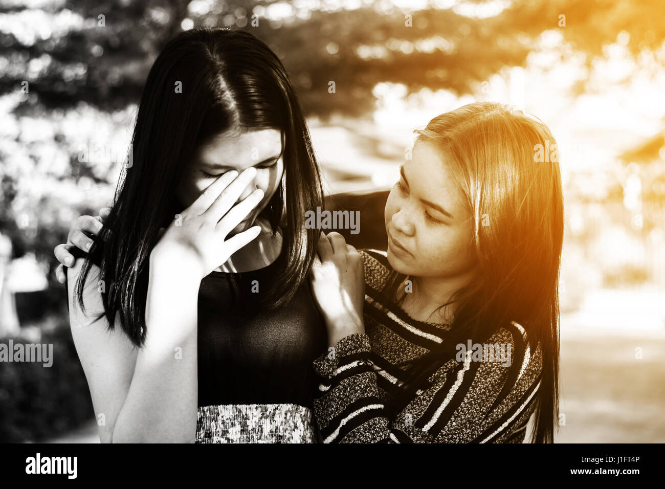 Friends hugging and giving consolation Stock Photo - Alamy