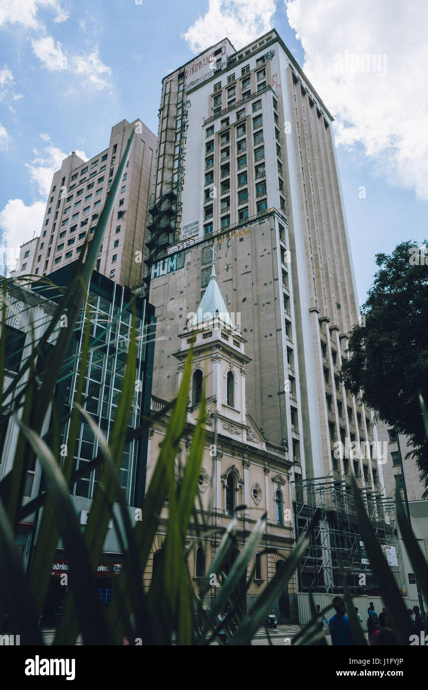 Old historic church in front of high-rise office buildings in Sao Paulo, Brazil Stock Photo