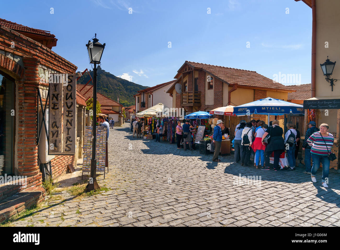 Mtskheta, Georgia - September 26, 2016: Market stalls with souvenirs for tourists on the street near Svetitskhoveli Cathedral Stock Photo