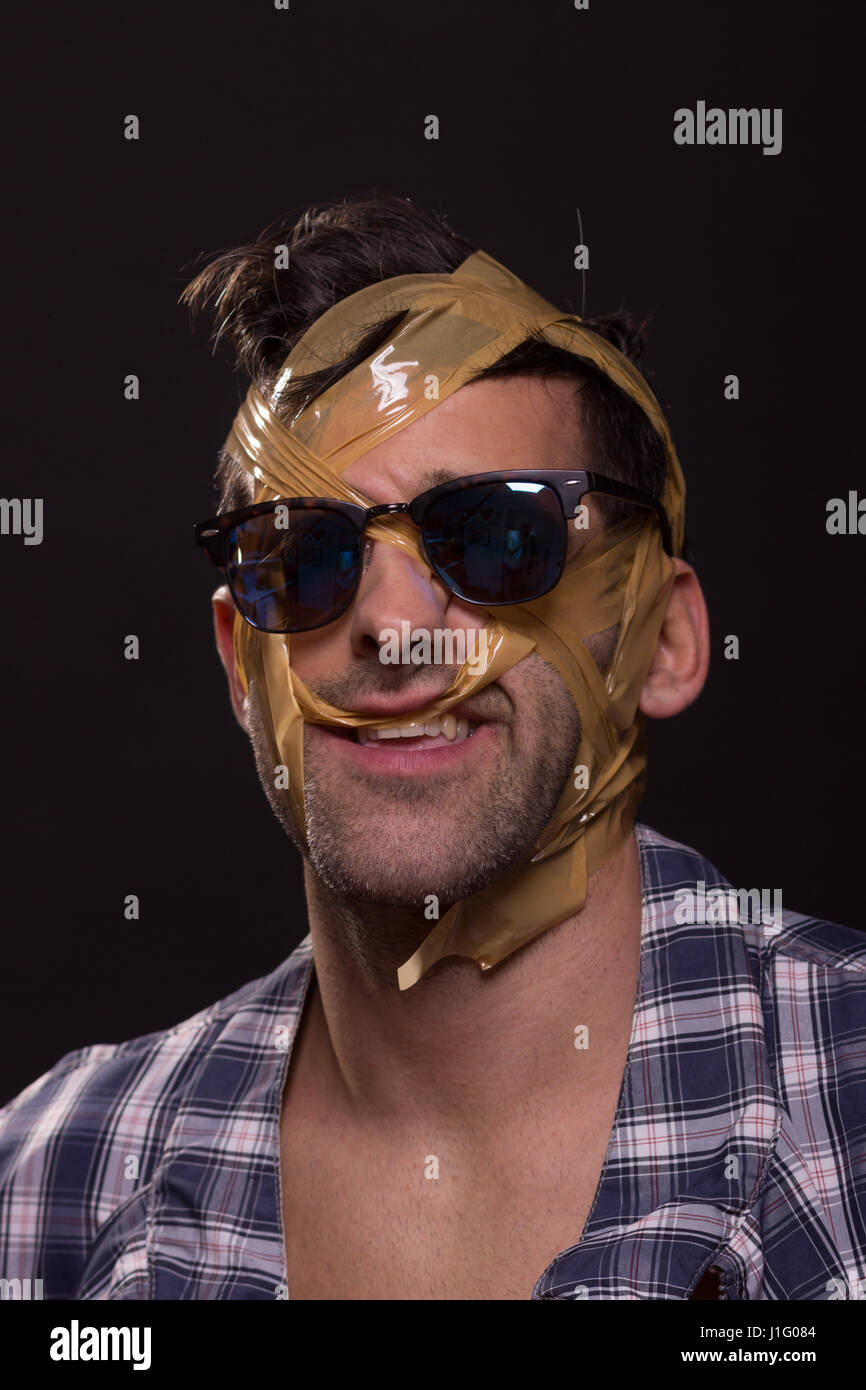 head face wrapped duct tape young man crazy Stock Photo Alamy