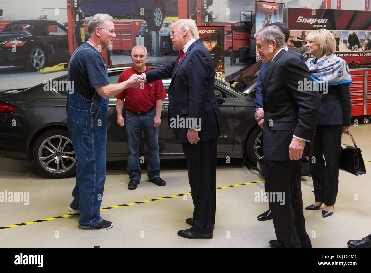U.S. President Donald Trump greets workers during a tour of SnapOn