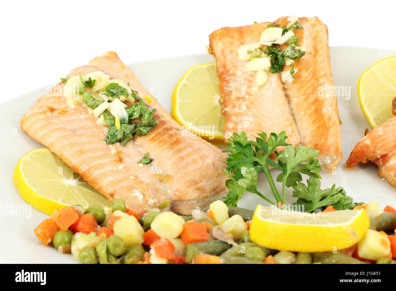 seafood salmon with salad and lemon Stock Photo