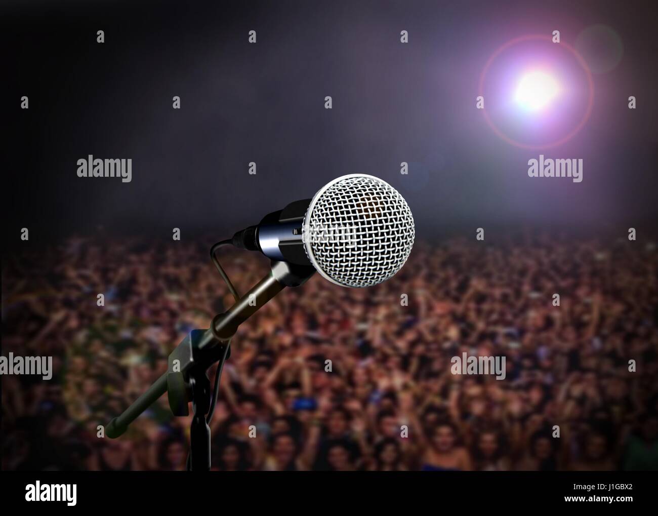 Microphone on stage with spotlight in concert Stock Photo Alamy