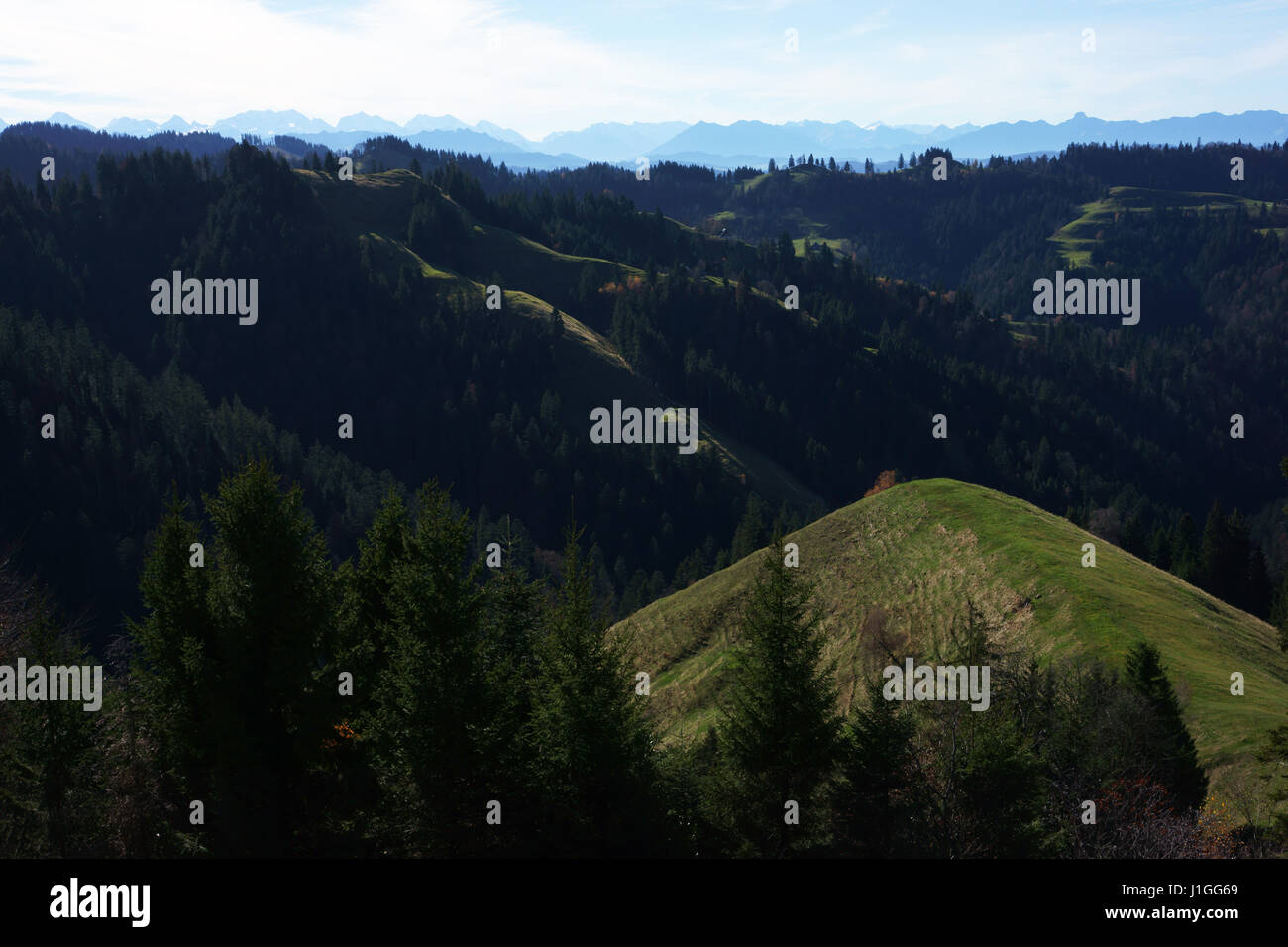 In the hills of Emmental near Lüderen with Bernese alps, Switzerland Stock Photo