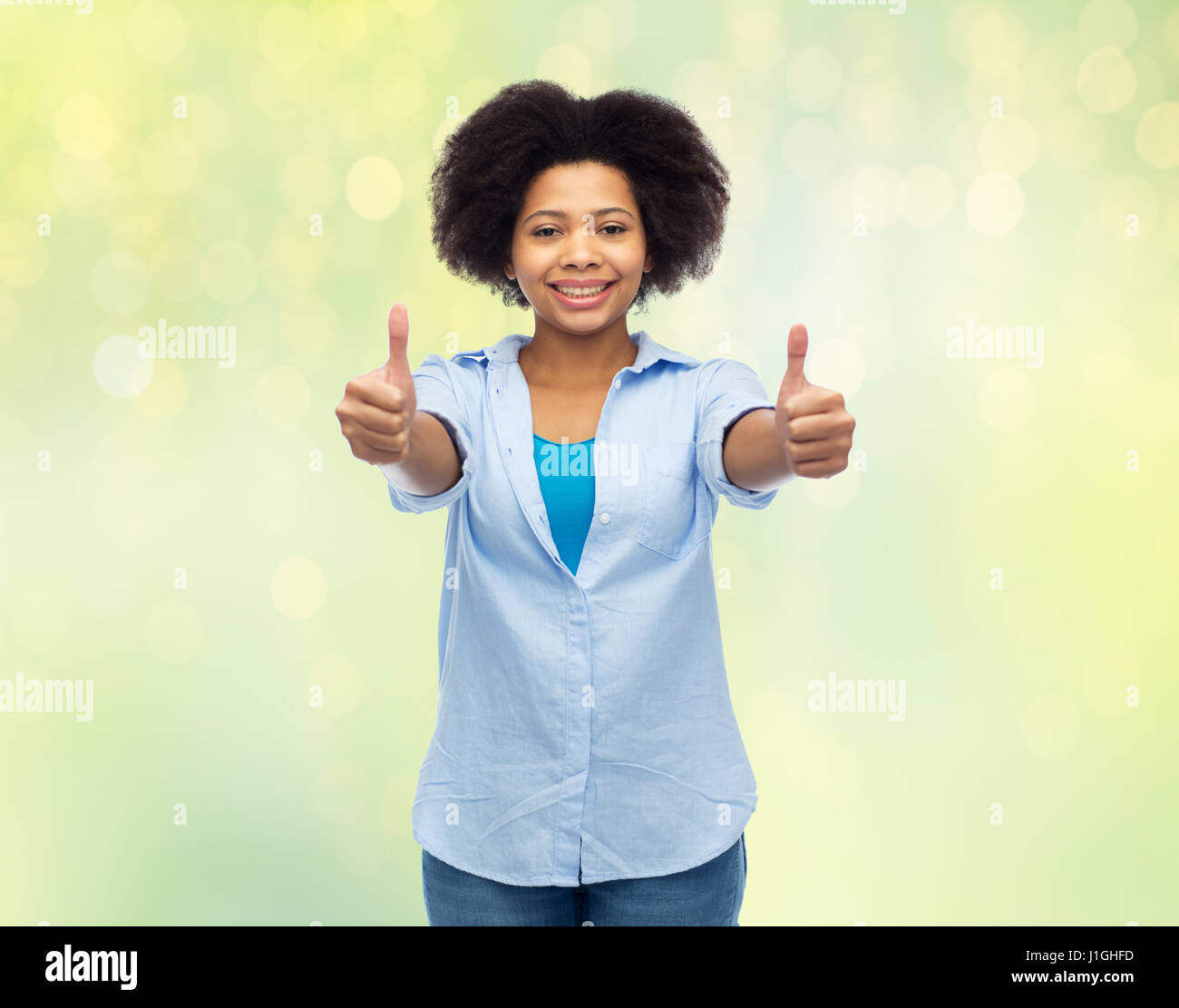 happy african american woman showing thumbs up Stock Photo - Alamy