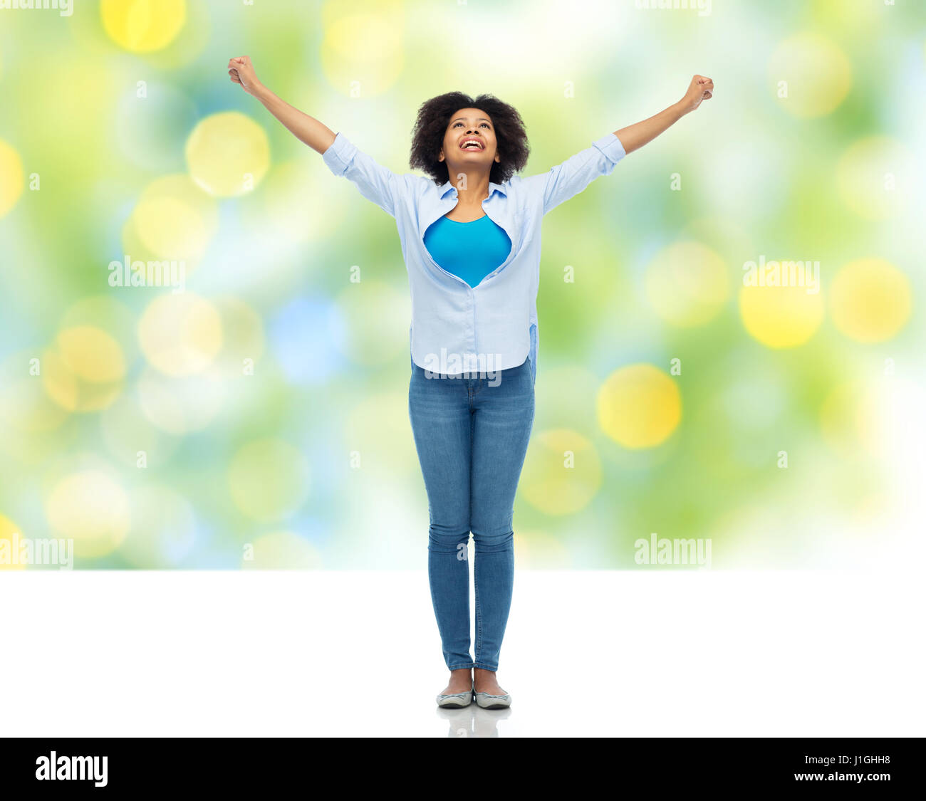happy african american young woman over white Stock Photo - Alamy