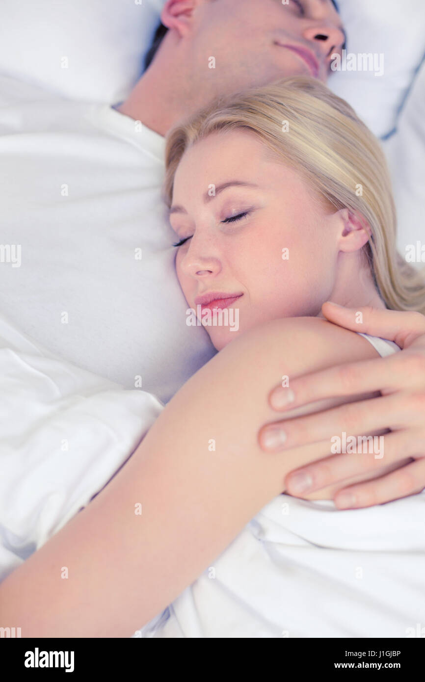 happy couple sleeping in bed Stock Photo - Alamy