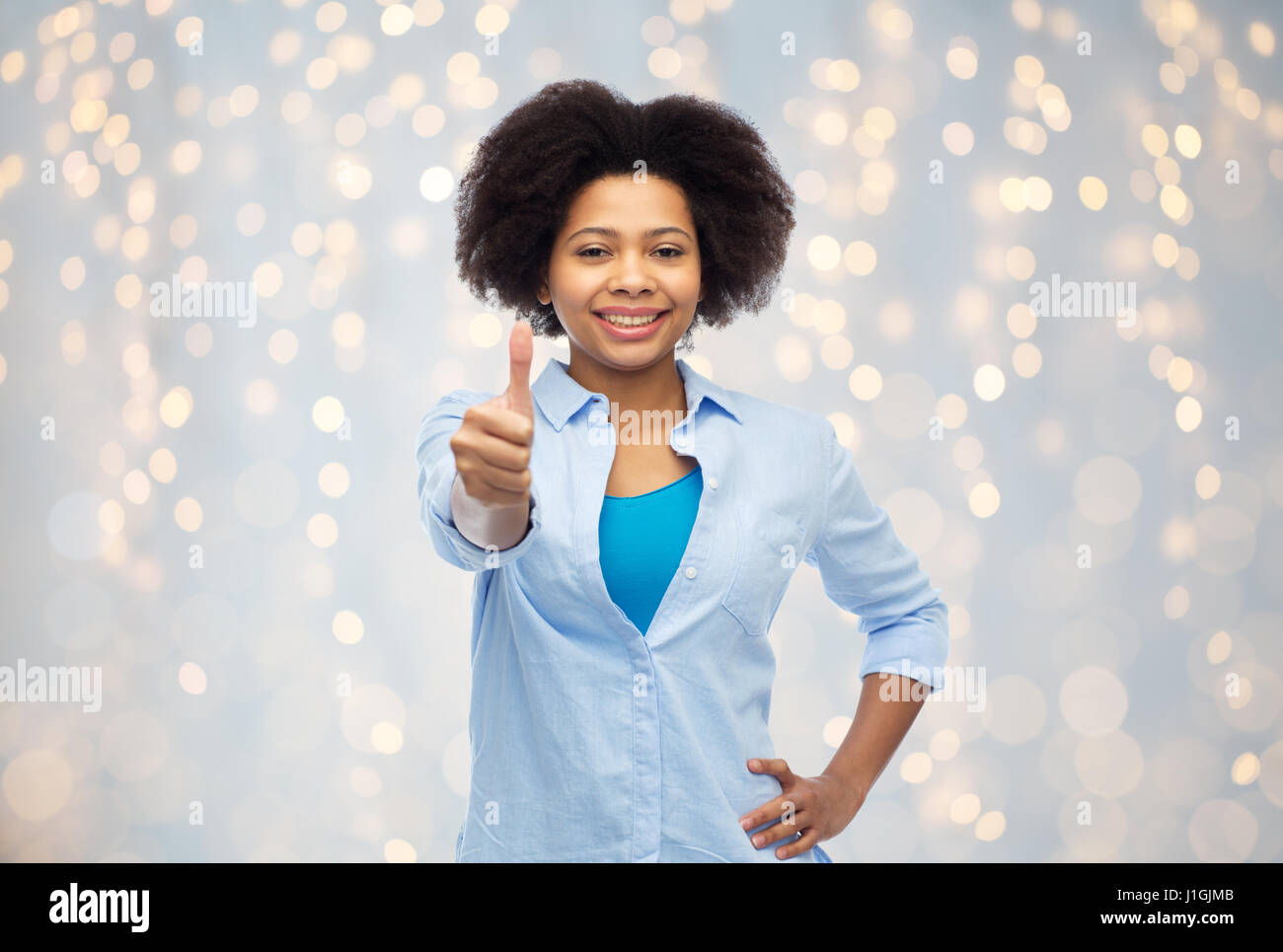 happy african american woman showing thumbs up Stock Photo - Alamy