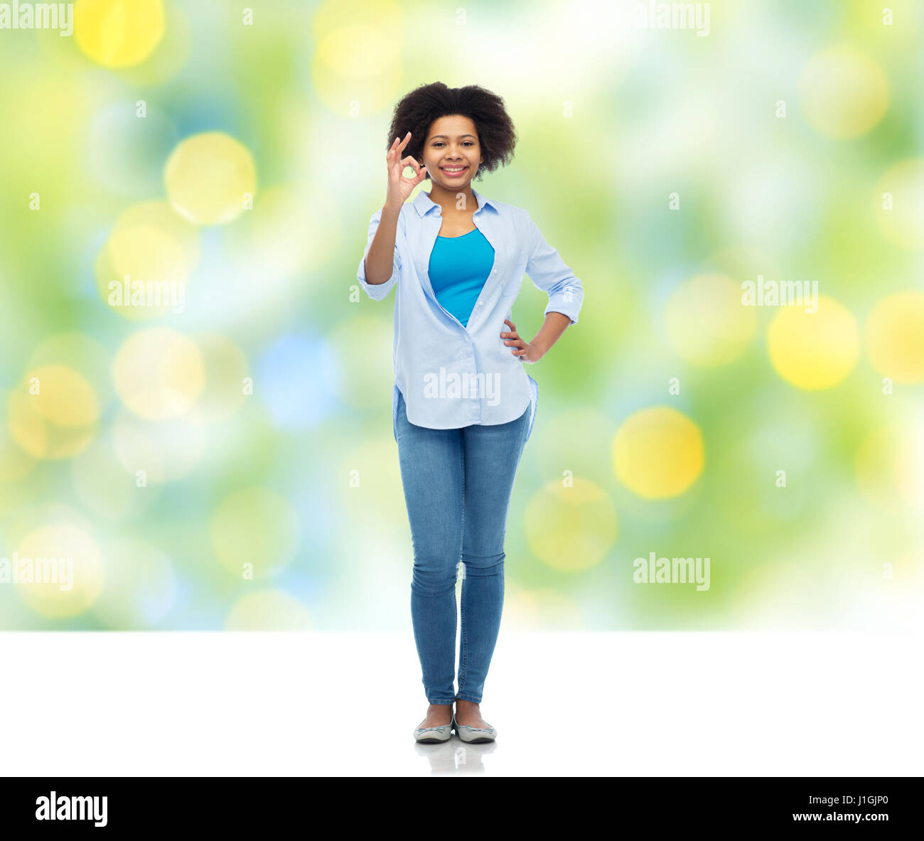 happy african american woman showing ok hand sign Stock Photo - Alamy