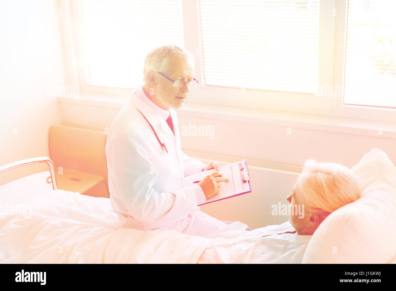 Old man hospital bed doctor hi-res stock photography and images - Alamy