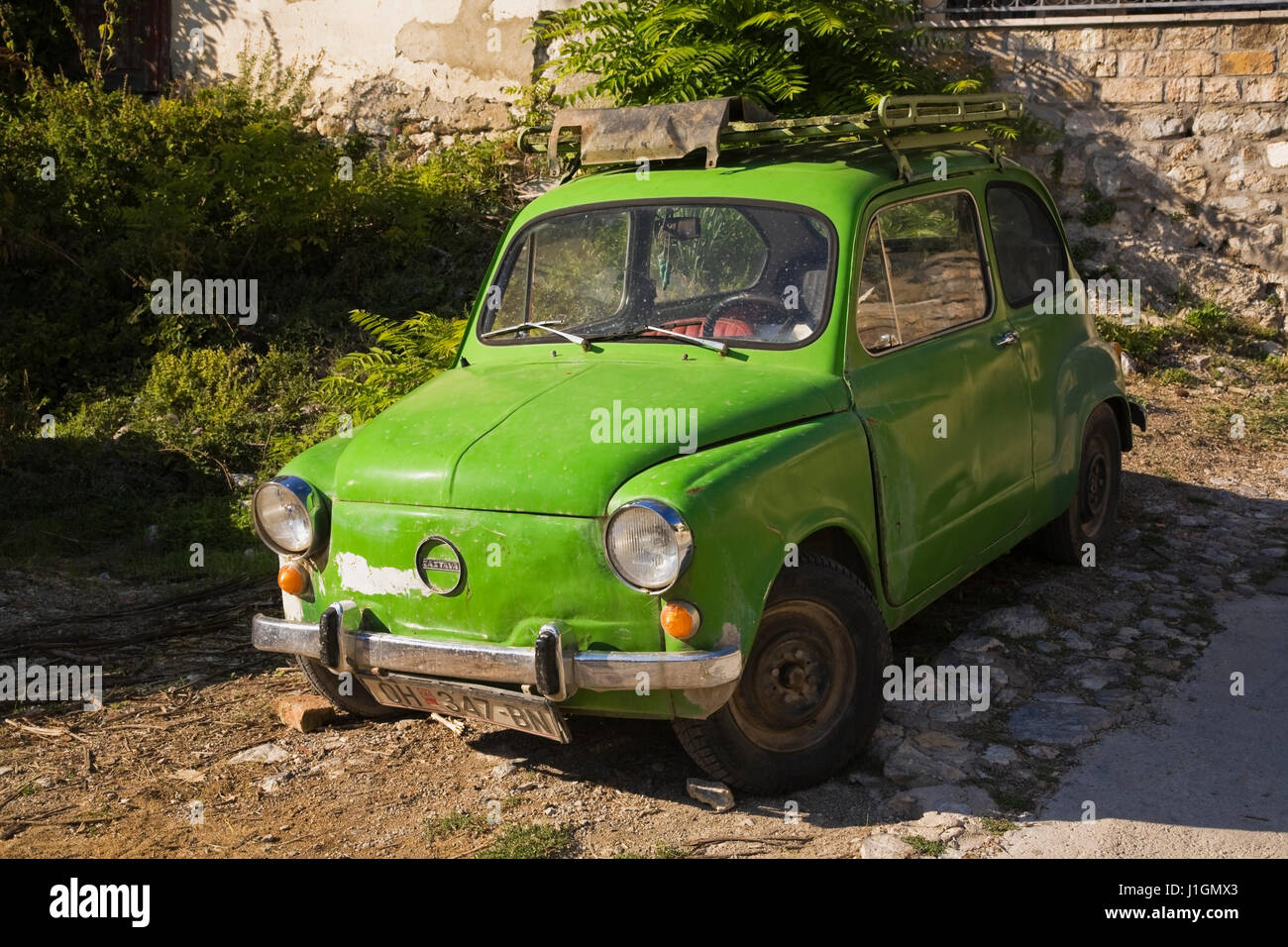 Parked green old model Zastava car nicknamed Fico or Ficek manufactured in the former Yugoslavia, Ohrid, Macedonia, Eastern Europe Stock Photo