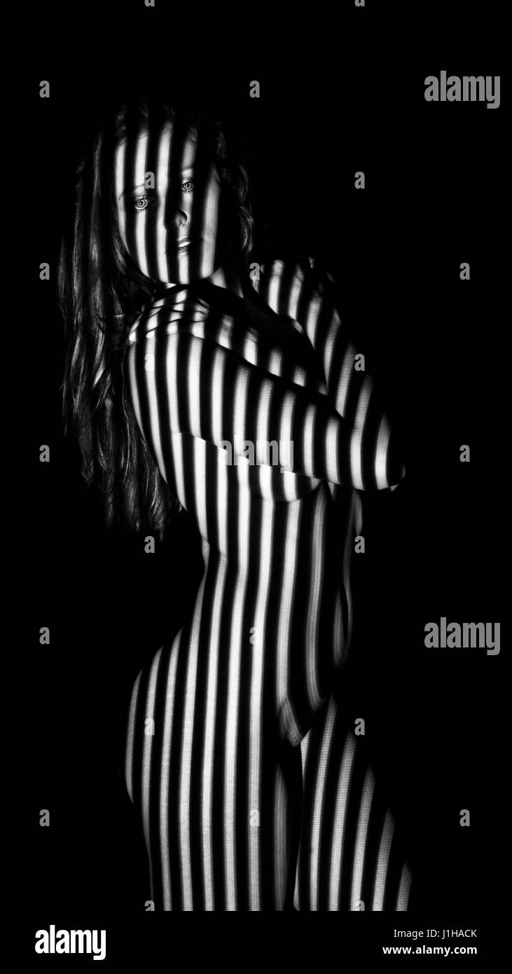 Young nude women with stripes on her body in black and white Stock Photo -  Alamy