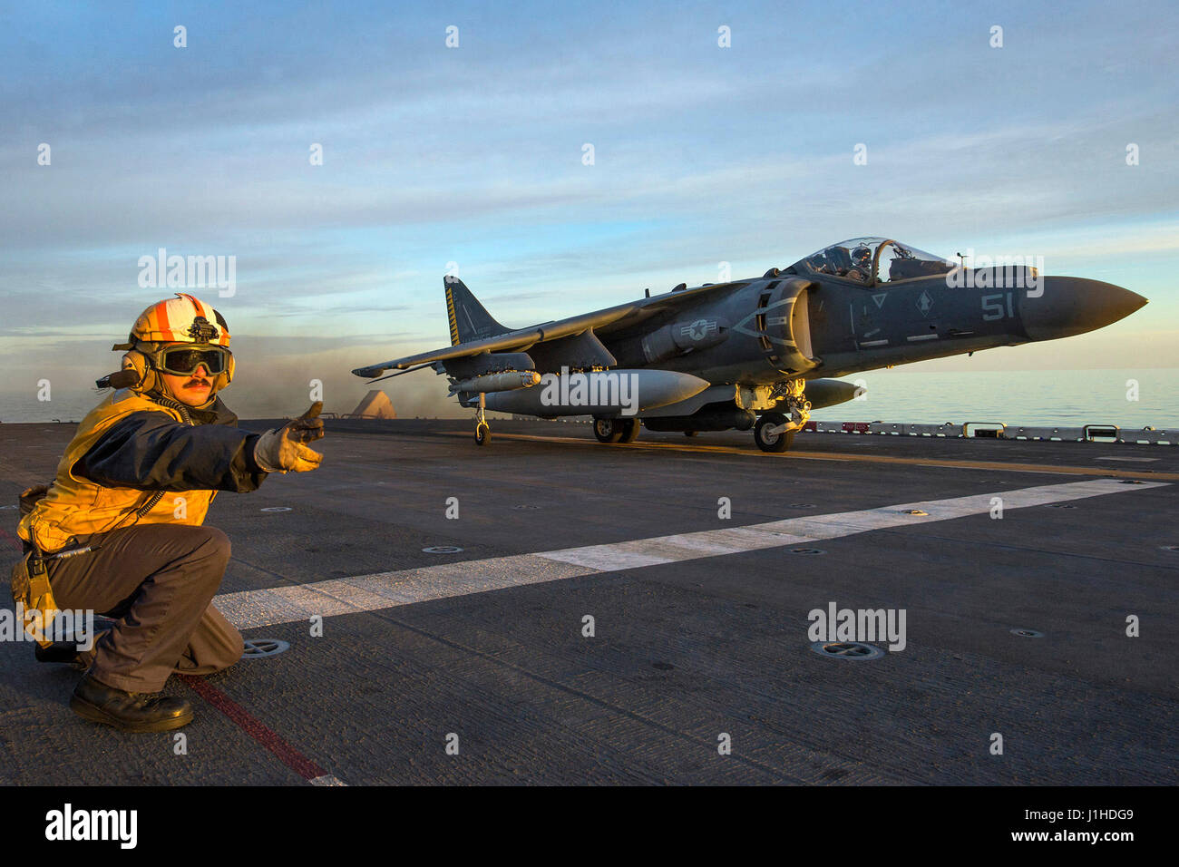 AV-8B Harrier, from the 22nd Marine Expeditionary Unit, takes off from the amphibious assault ship USS Wasp Stock Photo