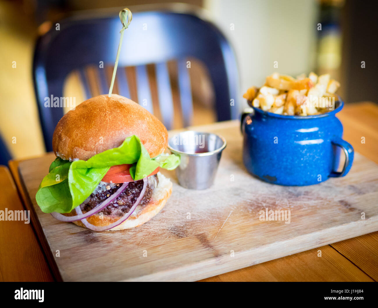 A classic burger and fries (hamburger and French fries) from Ayden Kitchen and Bar in Saskatoon, Saskatchewan, Canada. Stock Photo