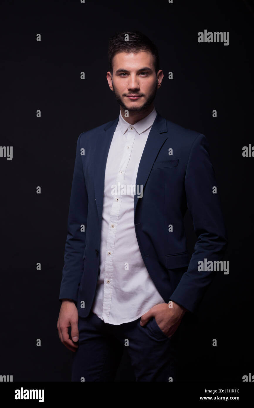 young adult man, 20s model posing, white shirt, blue jacket, suit pants