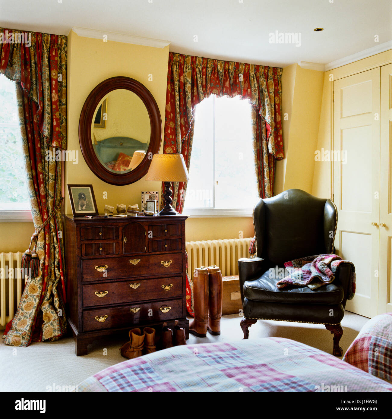 A bedroom with an armchair Stock Photo Alamy