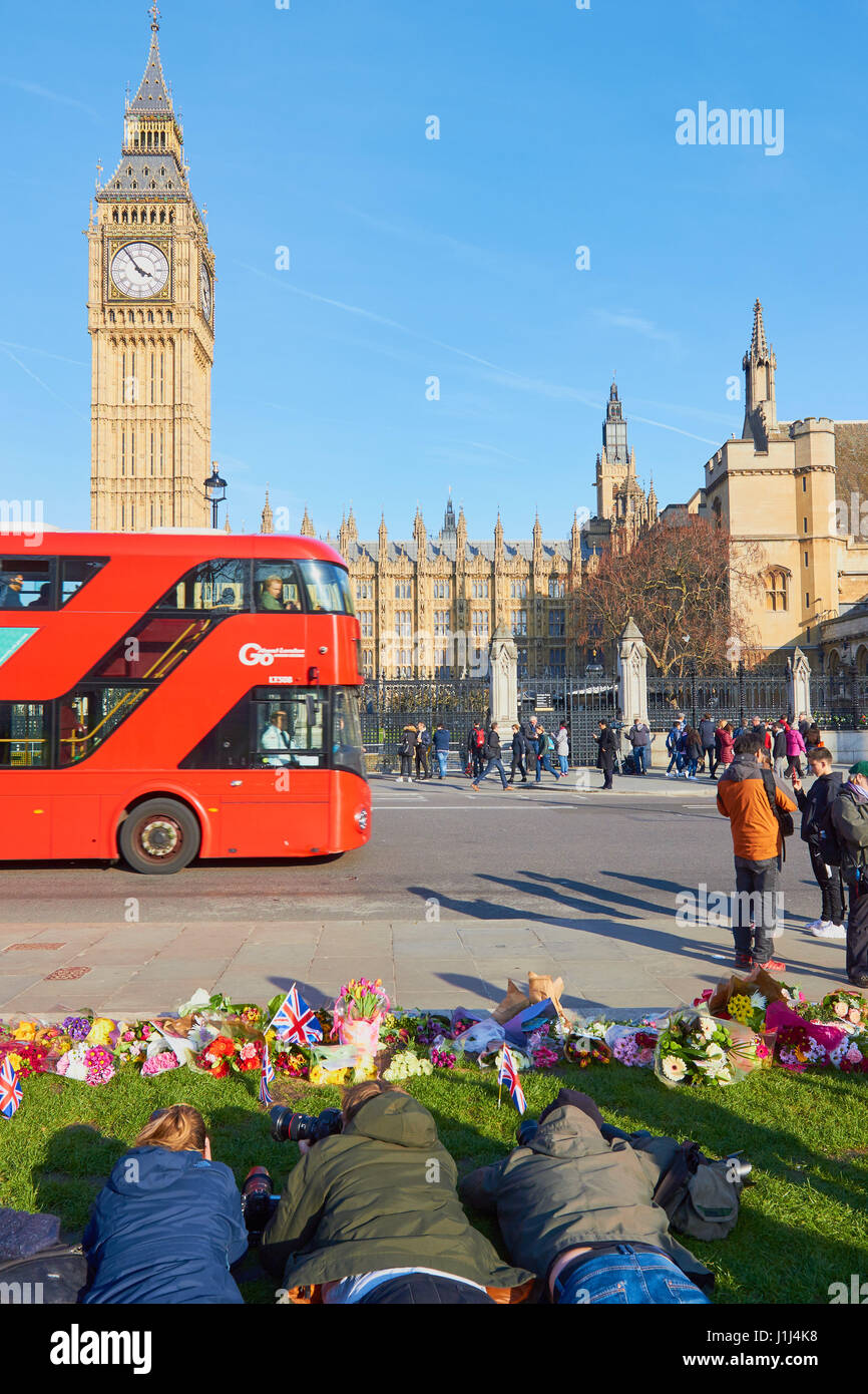 Photographers in Parliament Square and floral tributues to victims of the Westminster terrorist attack, London, England Stock Photo