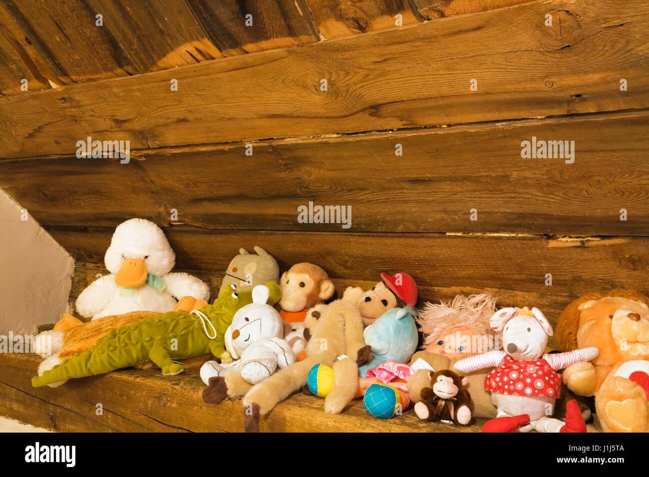 Plush animal toys in a child's attic bedroom in an Old Canadiana (circa