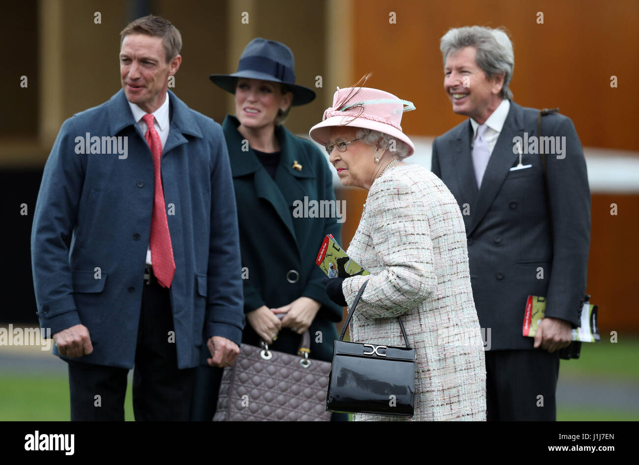 Queen Elizabeth II with her Bloodstock and Racing Advisor John Warren (right) and Richard Hughes (left) as she attends the Dubai Duty Free Spring Trials and Beer Festival at Newbury Racecourse in Newbury, on her 91st birthday. Stock Photo