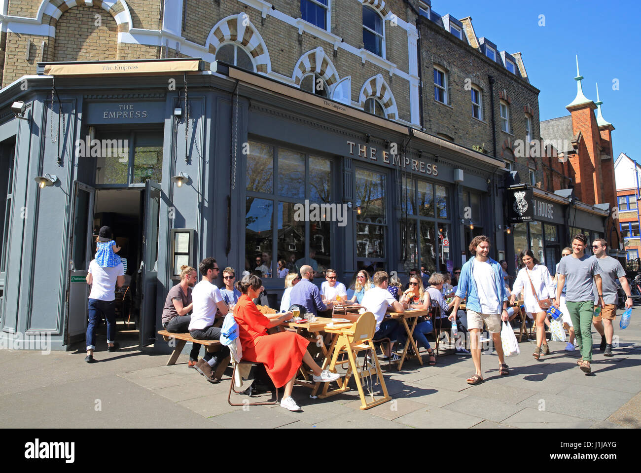 Bars and restaurants in trendy Lauriston Road in Victoria Village Park, east London, E9, UK Stock Photo
