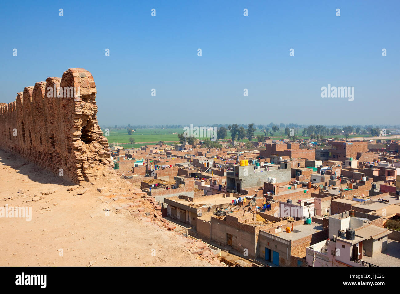 restoration work at the historical site of bhatner fort hanumangarh rajasthan india overlooking the town and countryside under a clear blue sky Stock Photo