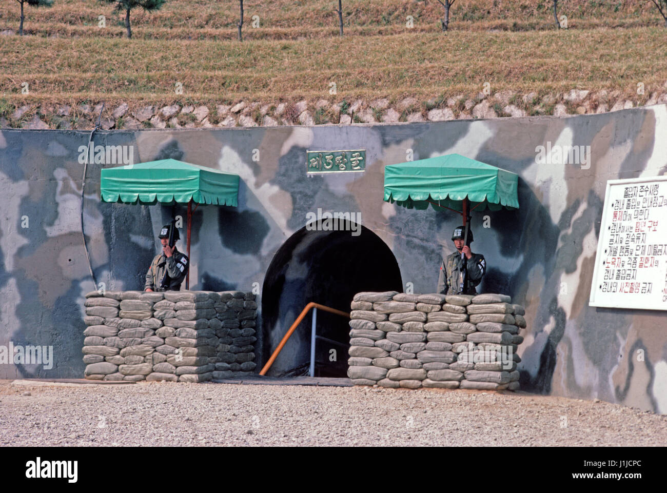 South Koreans guarding entrance to tunnels built by North Korea. In all