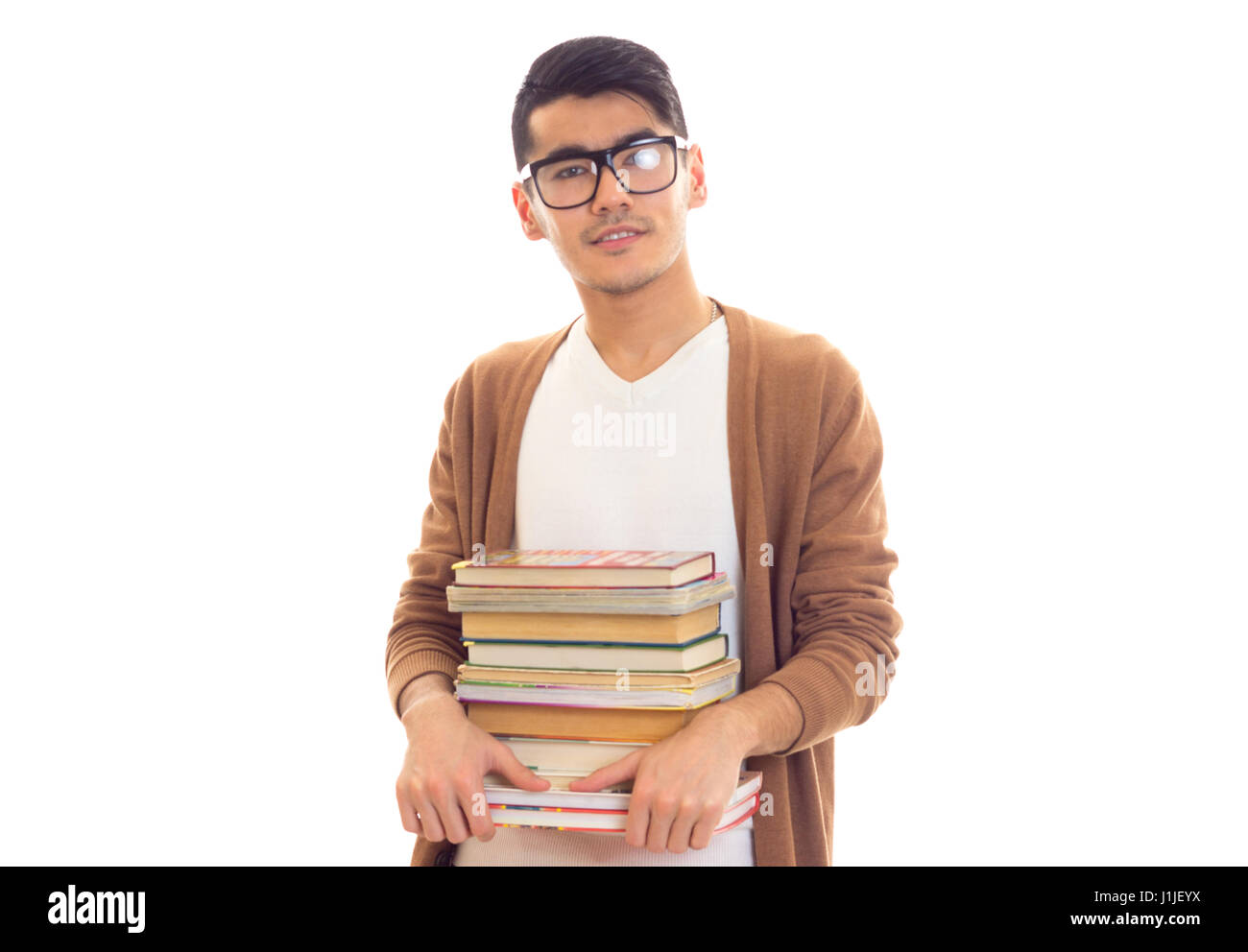 Young man in glasses with books Stock Photo