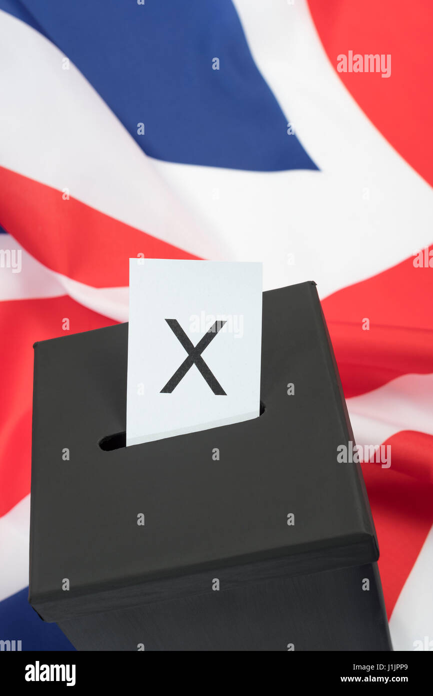 Replica black ballot box set against UK flag / Union Jack as metaphor for concept of British 2024 General Election - Brexit Election, Mock election. Stock Photo