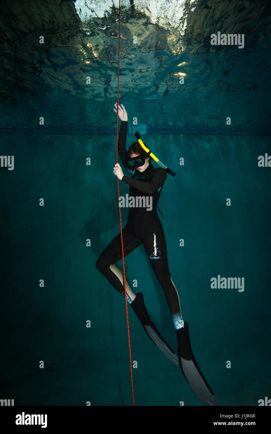 Young woman in a free diving class Stock Photo