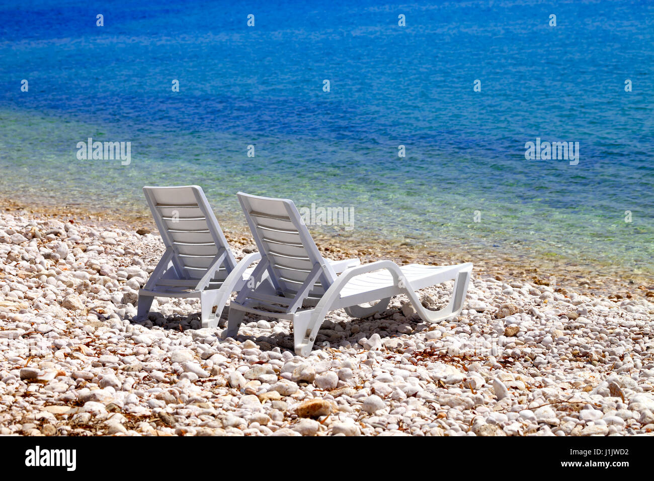 Deck chairs on beach hi-res stock photography and images - Alamy