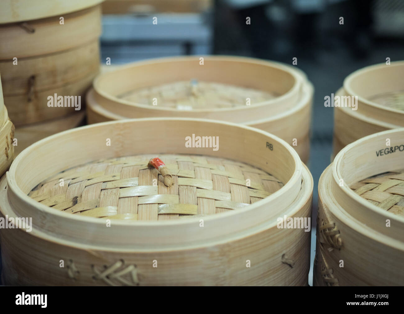 Dim sum bamboo basket containers in Chinese kitchen Stock Photo