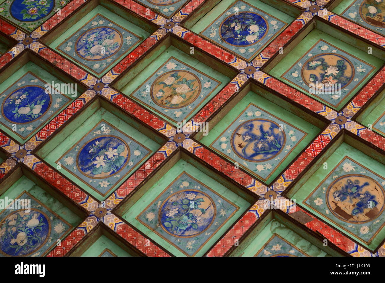 Beautiful Chinese art decorating the ceiling of the Forbidden City palace halls in Beijing Stock Photo
